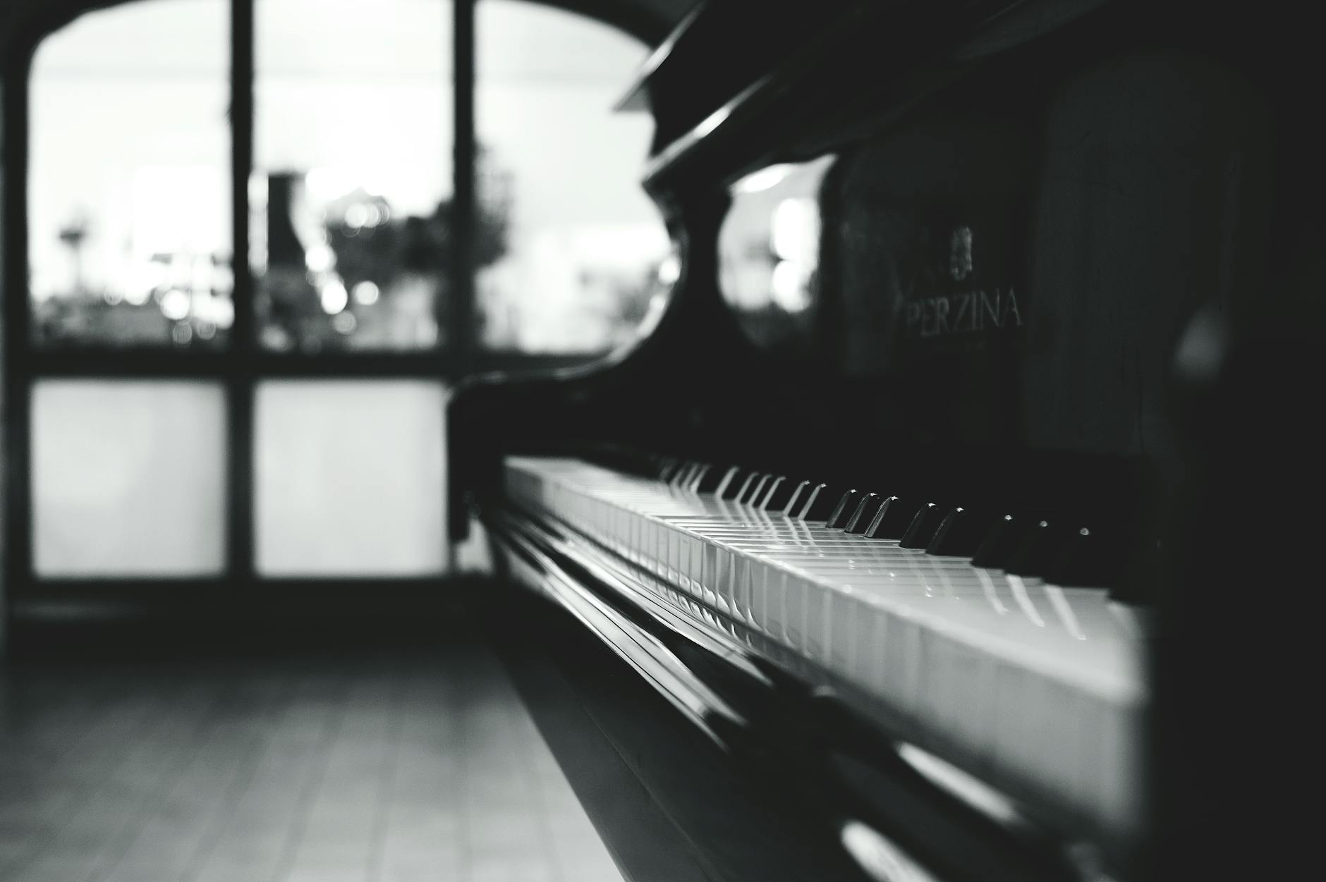 black grand piano gray scale photo