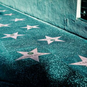 pink stars on gray tiled street sidewalk