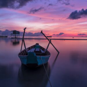 white row boat on body of water